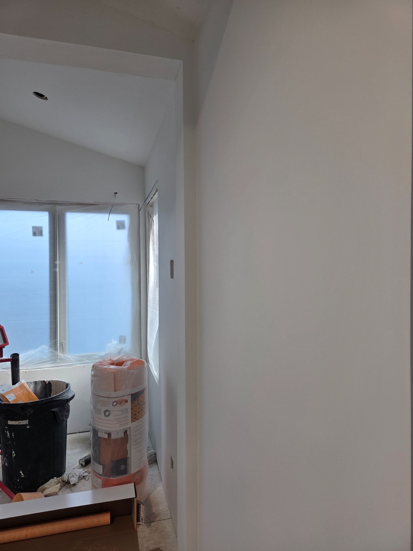 Smooth wall and outside corner during sanding and touch-ups on the Bainbridge Island Class 5 smooth wall project